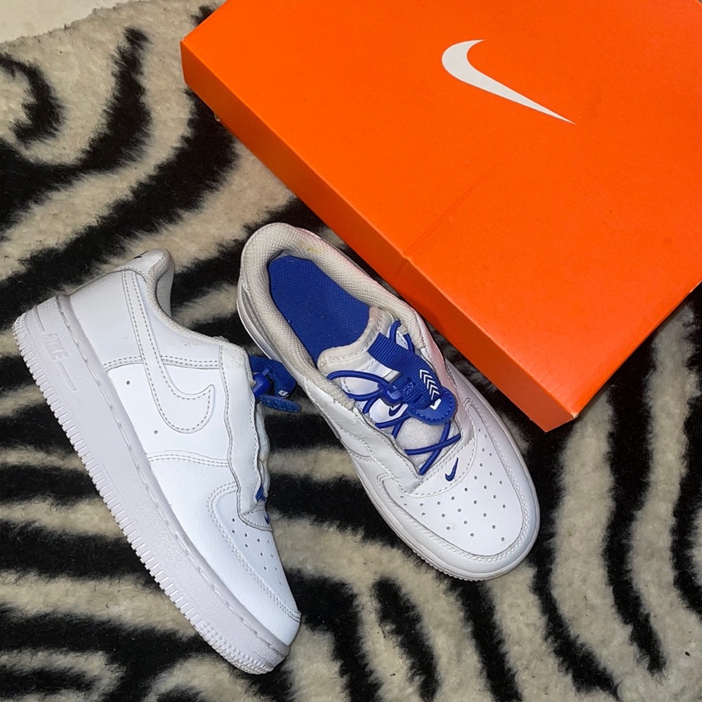 Nike Kids White Sneakers with Royal Blue Accents